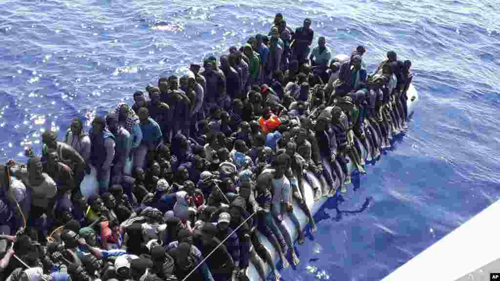 This photo released on June 24, 2018, by the Libyan Coast Guard shows migrants on a ship intercepted offshore near the town of Gohneima, east of the capital, Tripoli.