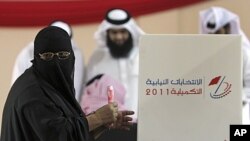 A woman at a polling station in Hamad Town, Bahrain, September 24, 2011.