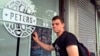 FILE - Peter Garratt, one of the sons of Canadian couple Kevin and Julia Dawn Garratt, who are being investigated in China for threatening national security, stands outside his parents' coffee shop as he talks to Reuters journalists in Dandong, Liaoning province, China, Aug. 6, 2014.