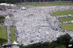 Indonesian Muslims gather during a rally against Jakarta's minority Christian Governor Basuki "Ahok" Tjahaja Purnama who is being prosecuted for blasphemy, at the National Monument in Jakarta, Indonesia, Dec. 2, 2016.