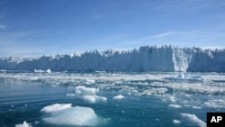 Polar ice sheets in Greenland (pictured above) and Antarctica are losing mass at an accelerated rate and will add significantly to sea level rise.