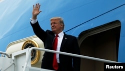 President Donald Trump arrives aboard Air Force One at Palm Beach International Airport in West Palm Beach, Fla., March 3, 2017.