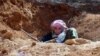 This citizen journalism image provided by ENN shows a Syrian rebel in a trench, in Idlib province, northern Syria, June 12, 2013. 