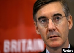Conservative MP Jacob Rees-Mogg attends a meeting of the pro-Brexit European Research Group in London, , Nov. 20, 2018.