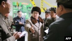 This undated photo released by North Korea's official Korean Central News Agency (KCNA) on April 1, 2016 shows North Korean leader Kim Jong-Un (C) visting the Sinhung Machine Plant in South Hamgyong Province.