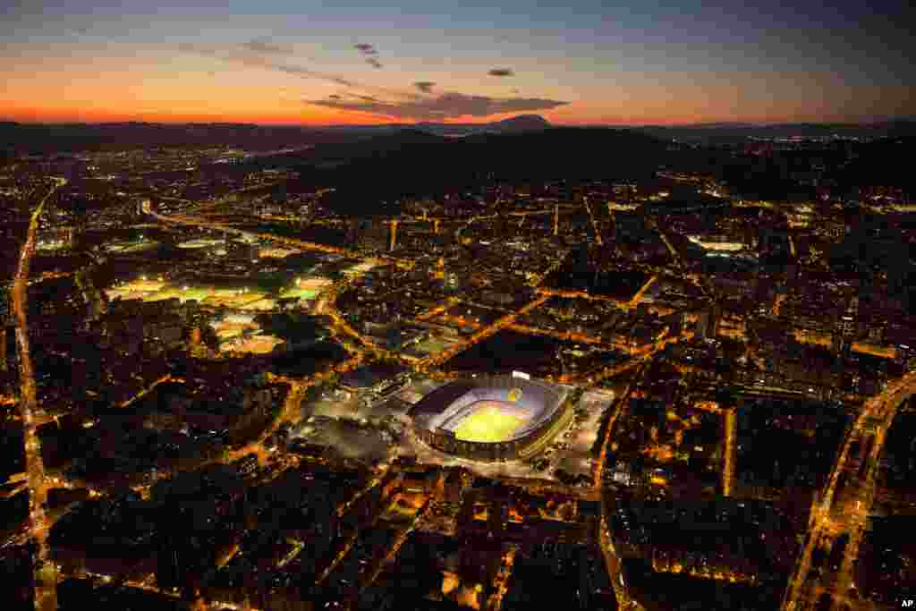 The Camp Nou stadium is illuminated ahead of a soccer match between Barcelona FC and Eibar, in Barcelona, Spain, Sept. 19, 2017.