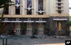 Debris is seen outside Santa Maria church, where an explosion went off in Surabaya, East Java, Indonesia, May 13, 2018. Media reports say simultaneous attacks on churches in Indonesia's second largest city of Surabaya have left casualties.