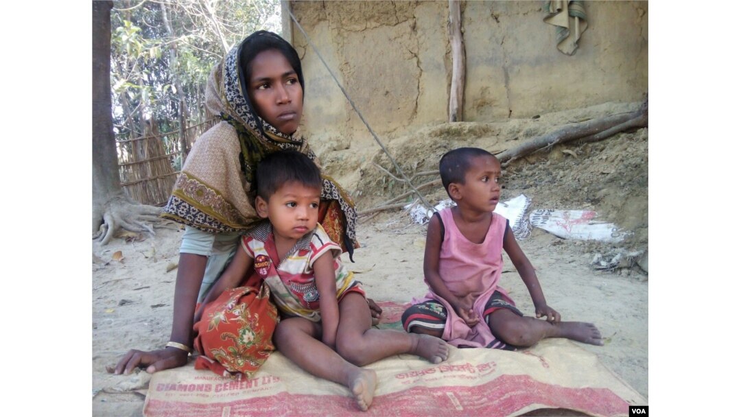 Rohingya refugee Arofa Begum and her two children at a Rohingya refugee colony in Cox's Bazar, Bangladesh. After Begum's husband and 15-year-old son was burnt alive by the Burmese soldiers, she fled to Bangladesh with her two children in December. "There is no adult male in my family. I will be at sea if I am forced to relocate to Thengar Char island. Although life is very risky for all Rohingyas in Myanmar, with my children I have no other option except going back to our home country," Begum told VOA. (Photo: S. Islam for VOA)