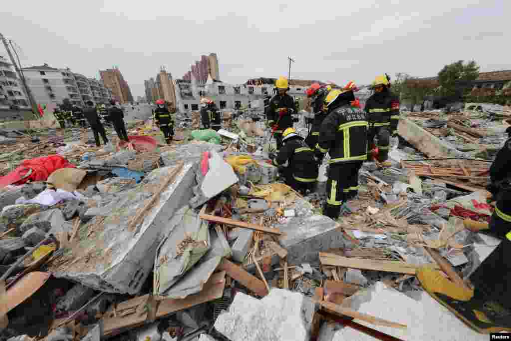 Rescue workers work at the site of a blast in Ningbo, Zhejiang province, China.