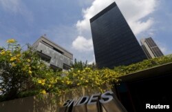 FILE - The headquarters of oil company Petrobras, left, is pictured next to the headquarters of Brazilian Development Bank in Rio de Janeiro, March 20, 2015.