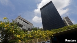 FILE - The headquarters of oil company Petrobras (L) is pictured next to the headquarters of Brazilian Development Bank (BNDES) in Rio de Janeiro. Investigators are continuing to probe a massive political kick-back scheme centered on the state-run oil company.