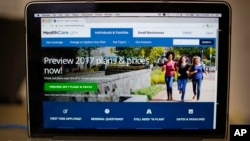 FILE - The HealthCare.gov 2017 home page is seen on a laptop in Washington.