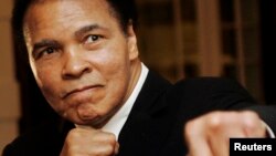 FILE - U.S. boxing great Muhammad Ali poses during the Crystal Award ceremony at the World Economic Forum (WEF) in Davos, Switzerland, January 2006. 