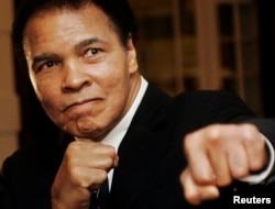 FILE - U.S. boxing great Muhammad Ali poses during the Crystal Award ceremony at the World Economic Forum (WEF) in Davos, Switzerland, January 2006.