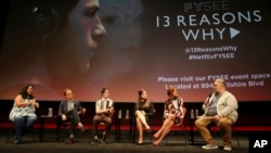 FILE - Jenelle Riley, director Tom McCarthy, Dylan Minette, Katherine Langford, Kate Walsh and executive producer Brian Yorkey talk about Netflix's "13 Reasons Why" at an event at the Samuel Goldwyn Theater, Los Angeles, June 2, 2017.