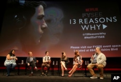 FILE - Jenelle Riley, director Tom McCarthy, Dylan Minette, Katherine Langford, Kate Walsh and executive producer Brian Yorkey talk about Netflix's "13 Reasons Why" at an event at the Samuel Goldwyn Theater, Los Angeles, June 2, 2017.
