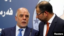 Haider al-Abadi, left, has been nominated as Iraq’a prime minister. He’s shown with Salim al-Jabouri, speaker of the Iraqi Council of Representatives in Baghdad on July 15, 2014.