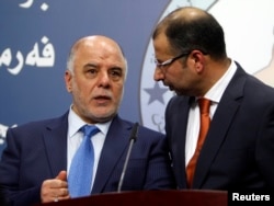 Haider al-Abadi, left, has been nominated as Iraq’s prime minister. He’s shown with Salim al-Jabouri, speaker of the Iraqi Council of Representatives in Baghdad, on July 15, 2014.