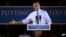 Republican presidential candidate Mitt Romney gestures during a campaign stop at Production Products in St. Louis, Missouri, June 7, 2012.