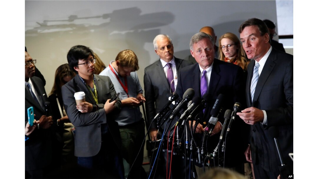 Senate Intelligence Committee Vice Chairman Sen. Mark Warner (R), accompanied by committee Chairman Sen. Richard Burr speak to the media on Capitol Hill in Washington, May 11, 2017.