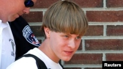 FILE - Police lead suspected shooter Dylann Roof into the courthouse in Shelby, North Carolina, June 18, 2015. 
