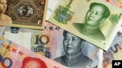 Billetes de renminbi o yuan de diferentes denominaciones. La divisa china fue agregada esta semana a la cesta de reservas del Fondo Monetario Internacional. 