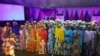 Chibok girls entertain guests during their send-forth dinner at A Class garden in Abuja, Nigeria. The girls will commence a special foundation program at American University of Nigeria Yola . 
