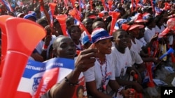 Supporters of opposition presidential candidate Nana Akufo-Addo cheer during his final campaign rally ahead of Friday's presidential election, in Accra, December 5, 2012. 