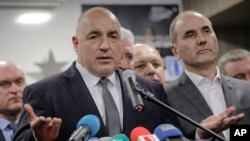 FILE - Bulgarian ex-Premier Boiko Borisov, leader of the center-right GERB party, gestures during a statement at the party's headquarters, in Sofia, Bulgaria, March 26, 2017. 