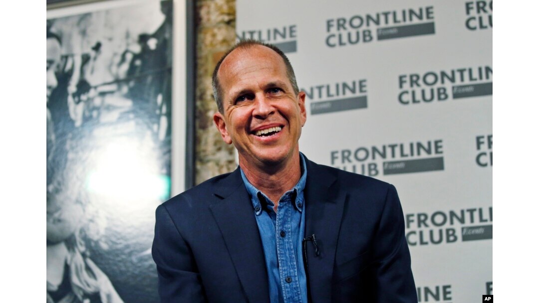 FILE - Freed Al Jazeera journalist Peter Greste smiles as he answers a question during an event in central London, Feb. 19, 2015.