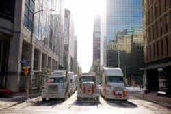 Vehicles block downtown streets as truckers and supporters protest COVID-19 vaccine mandates in Ottawa, Ontario, Canada, Feb. 1, 2022.