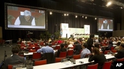 Delegates continue debating into the night during the United Nations Climate Change Conference (COP17) in Durban, South Africa, December 9, 2011.