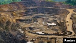 FILE - Excavators and drillers at work in an open pit at Tenke Fungurume, a copper and cobalt mine 110 kilometers northwest of Lubumbashi in Congo's copper-producing south, owned by miner Freeport McMoRan, Lundin Mining and state mining company Gecamines.