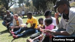 Sheffra Dzamara remembering her husband with members of Occupy Africa Unity Square in Harare. (Photo: Occupy Africa Unity Square)