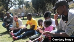 Sheffra Dzamara marking her husband's birthday with members of Occupy Africa Unity Square in Harare recently. (Photo: Occupy Africa Unity Square)