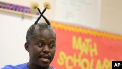 Haitian radio host and middle school teacher Salusa Basquin prepares a geometry class for students in West Palm Beach, Fla., May 9, 2017. In recent weeks, he has organized rallies in South Florida supporting extension of temporary protected status for Haitians. 