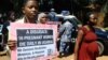 Activists hold a peaceful march in the capital Kampla to protest the delay by a Ugandan court to deliver a ruling in a landmark lawsuit regarding the cases of two women who unattended bled to death during childbirth.