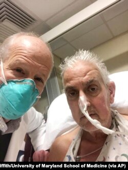 Bartley Griffith takes a selfie with patient David Bennett in Baltimore in January 2022. (Dr. Bartley Griffith/University of Maryland School of Medicine via AP)