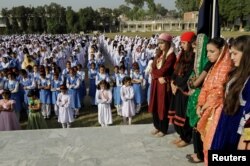 Students stand during morning assembly at the Islamabad College for girls in Islamabad, Pakistan, Oct. 13, 2017.