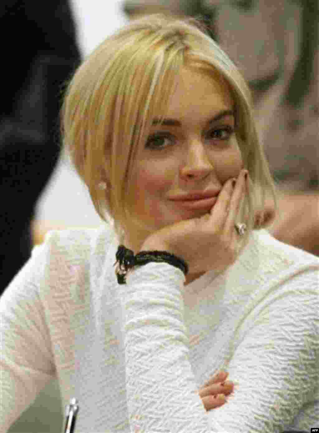 FILE - In this Feb. 9, 2011 file photo, actress Lindsay Lohan appears in court during her arraignment on a felony grand theft charge at the LAX Airport Courthouse in Los Angeles. (AP Photo/Mario Anzuoni, file)
