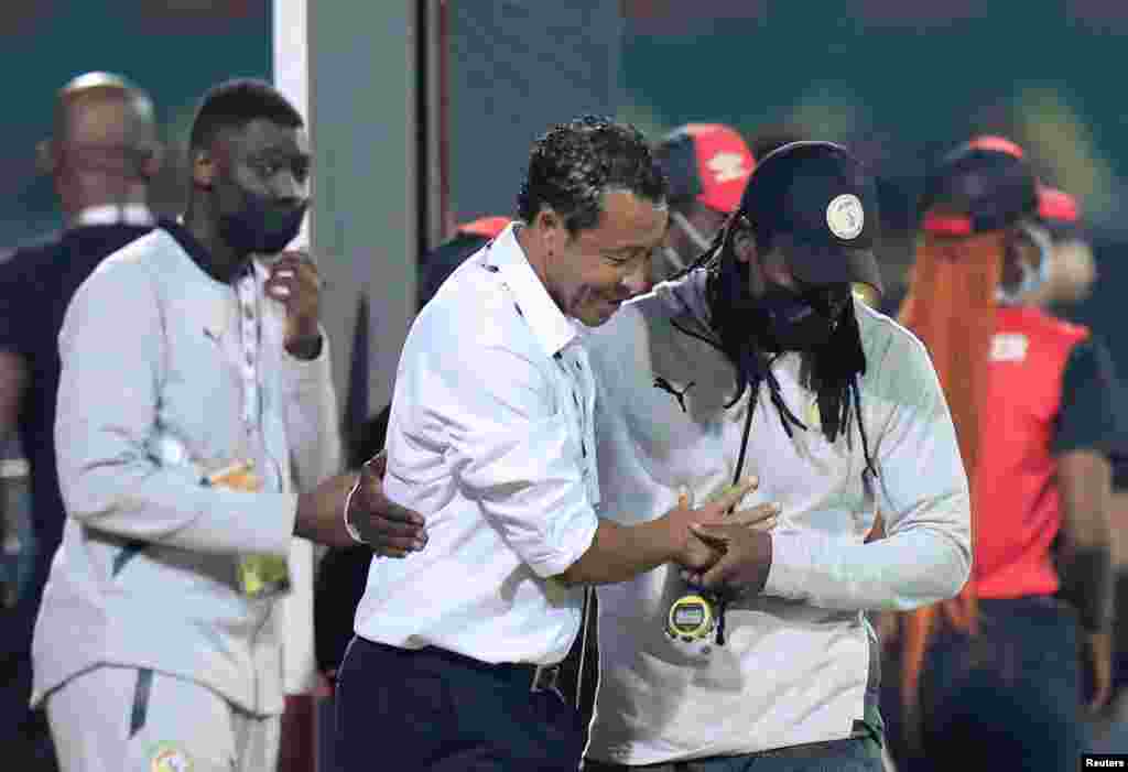 Cape Verde coach Pedro Leitão Brito commonly known as Bubista with Senegal coach Aliou Cisse after the match opposing their two countries in Cameroon, Jan. 25, 2022.