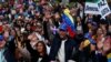 FILE - Protesters gather to call for humanitarian aid for Venezuela, in Madrid, Spain, Feb. 23, 2019.