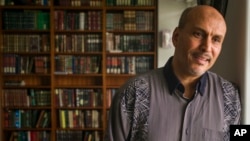 Hakim Ouansafi, president of the Muslim Association of Hawaii, speaks about an amended lawsuit filed by the Hawaii attorney general, during an interview in the library room of the association's mosque, March 9, 2107, in Honolulu. 