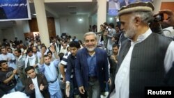 Afghan presidential candidate Abdullah Abdullah arrives for a gathering with his supporters in Kabul, July 8, 2014. 