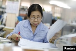 Sunisa Hongaroon, a 67-year-old accountant, works in a transportation company in Bangkok, Thailand, February 3, 2016.