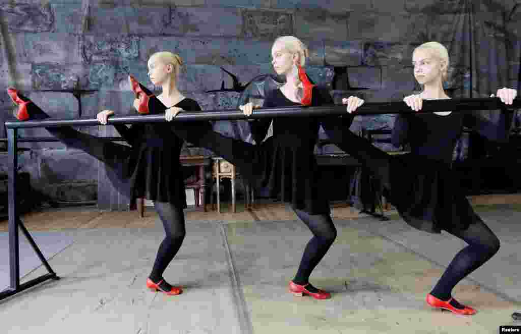 Triplet sisters Natalia, Irina and Tatiana Mironenko rehearse at the State Theatre of Opera and Ballet to prepare for their performances examination at the Krasnoyarsk choreographic college in Krasnoyarsk, Russia.