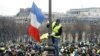 Protesters wearing yellow vests take part in a demonstration in Paris, Jan. 19, 2019.