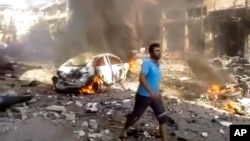 지난 14일 시리아 이들리브주 다르쿠스에서 발생한 차량 폭발 현장. (자료사진)