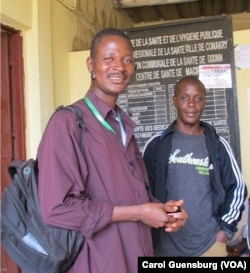 Community agents play a vital role in tracing Ebola contacts and monitoring their health. Here, two are shown at the Centre de Sante de Macire, a health center in Conakry, Guinea.