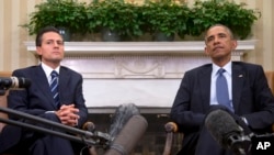 ARSIP - Presiden Barack Obama menjadi tuan rumah pertemuan bilateral dengan Presiden President Enrique Peña Nieto Meksiko (6/1/2015). Oval Office, Gedung Putih, Washington, D.C.
